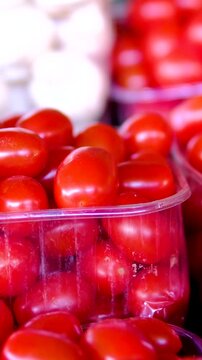 red cherry tomatoes at market. vibrant cluster of ripe, red cherry tomatoes