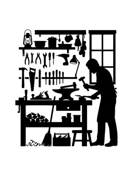Silhouette of a craftsman working in a workshop with hand tools