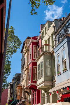 Istanbul, turkey, august 2, 2025 balat district showcasing traditional ottoman residential architecture with vibrant building facades under a clear blue sky