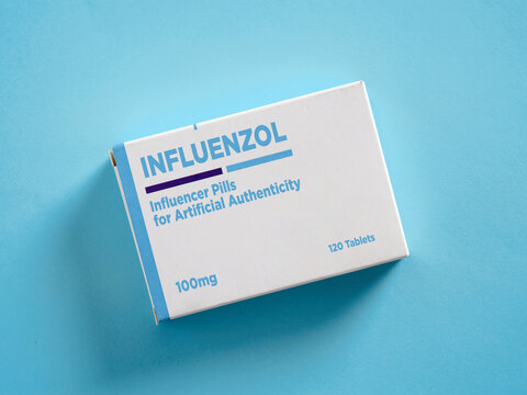 Influencer pills for artificial authenticity medicine box on blue background