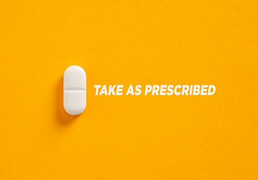 White Pill Reminding to Take Medication as Prescribed on Vibrant Yellow Background