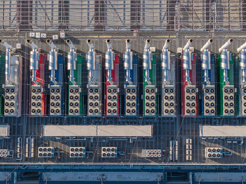 Aerial view of the Vantage Data Centers I FRA11 facility featuring rows of industrial cooling units and ventilation systems on the rooftop in Offenbach am Main, Hessen, Germany.