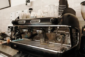 Fotobehang Horeca Commercial espresso machine ready for coffee preparation behind the bar. Professional cafe equipment used for brewing espresso and specialty coffee drinks  © Ekaterina