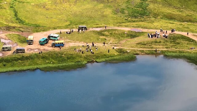 Numerous jeeps and buses carry tourists to Lake Dogyaskab,  Carpathian mountains, Ukraine