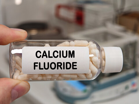 CALCIUM FLUORIDE hard capsule mineral compound supplement for mineral intake and physiological function support in a pharmaceutical factory quality control lab