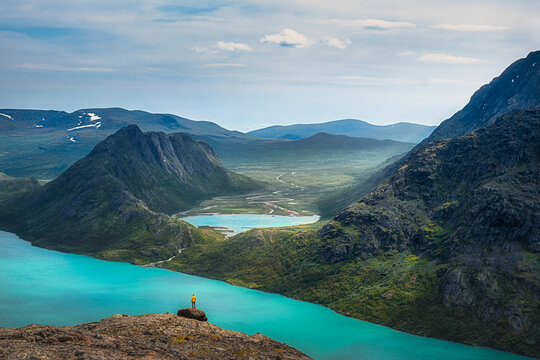 Landscape view of mountain wilderness with lakes and hiker, Besseggen, Jotunheimen, Norway