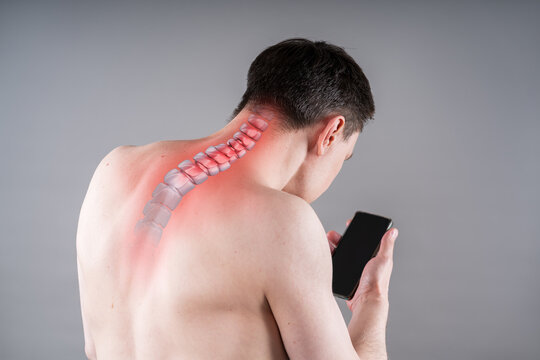 Man with neck pain from using smartphone, text neck and bad posture, painful area highlighted in red, graphic skeleton spine