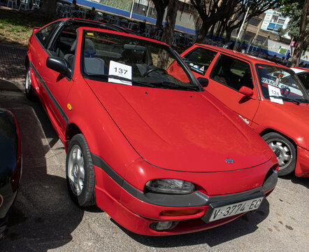 Tavernes Blanques, Spain - June 14, 2026. Bright red Nissan targa coupe displayed at vintage auto event in Spain