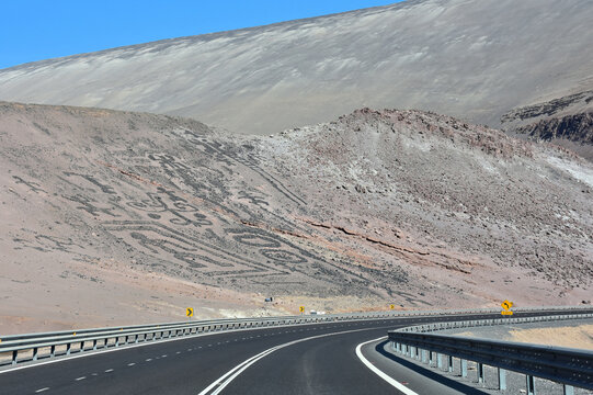 View of ancient (created by pre-Hispanic cultures like Inca) petroglyphs (geoglyphs)  along the Desert Highway (la Ruta del Desierto). Atacama Desert. Chile. 