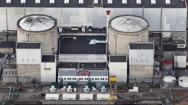 Aerial view of the Fessenheim Nuclear Power Plant with its distinctive reactor containment buildings and industrial infrastructure in Fessenheim, Grand Est, France.