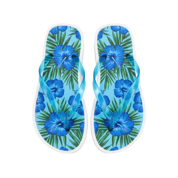 Pristine pair of thick-soled summer flip-flops, white soles and translucent light blue straps, featuring a vibrant tropical pattern of cobalt hibiscus and palm leaves, commercial luxury summer