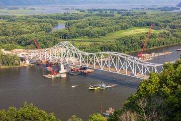 Fototapeta premium Mississippi River Bridge Construction Scenic Landscape with Car Ferry