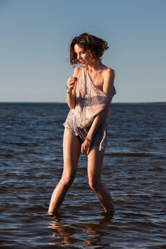 Woman posing in the lake water