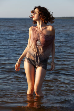 Wet Woman Standing In River Water