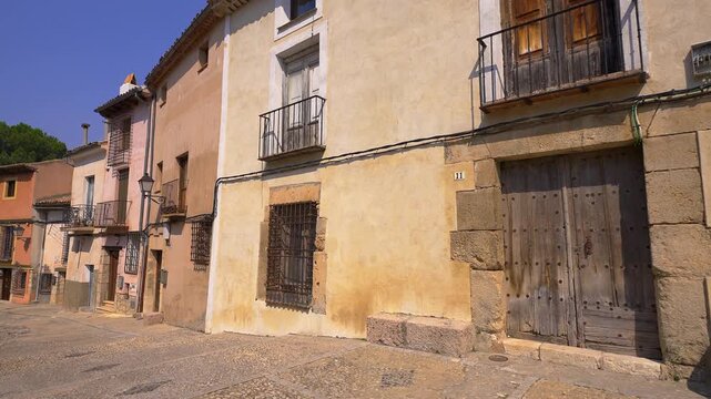 Traditional houses along a cobbled street in Barrio de San Pedro in medieval Cuenca Spain