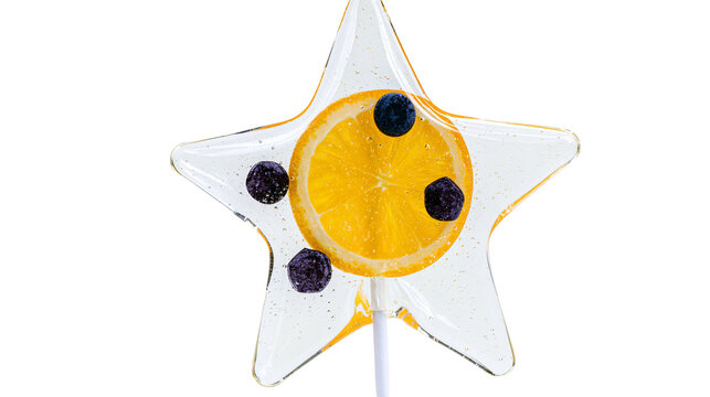 Star shaped clear lollipop with orange slice and blueberries, isolated on transparent background