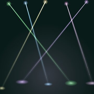 Abstract composition of crossing colorful laser beams and spotlight projections on dark background with spotlights