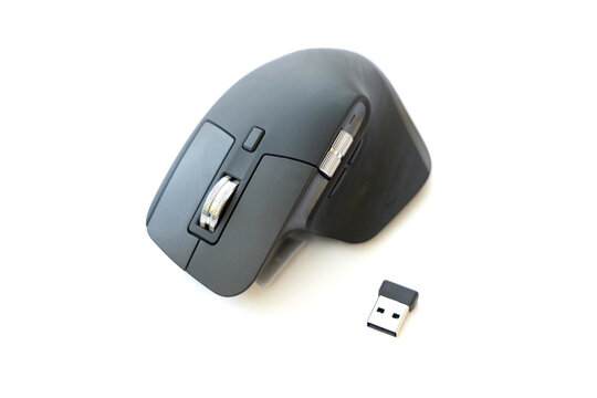 Modern wireless computer mouse with USB receiver on white background