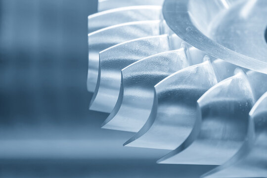 Close up of metal water turbine part in blue tone lighting
