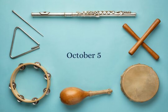 October 5 music holiday concept flat lay with various percussion instruments on light blue background