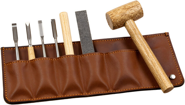 Leather tool roll with wood carving chisels and mallet