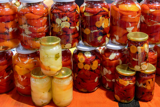 Colorful homemade pickled vegetables inside glass jars tradition in Balkan