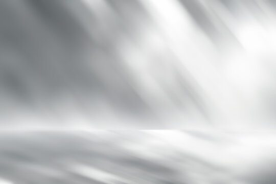 White and gray studio backdrop with star light scene, blank perspective stage for product montage or artwork.