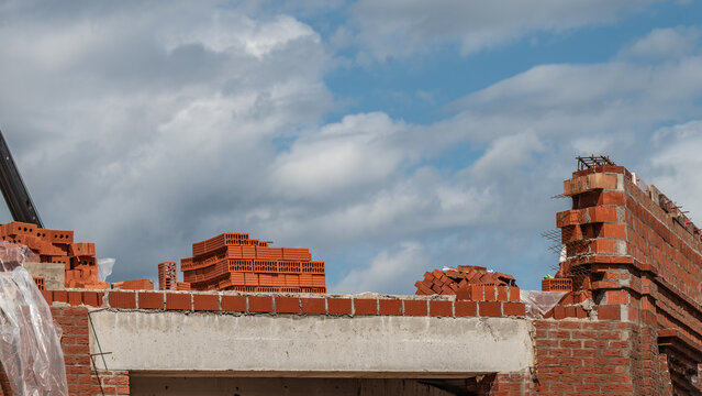 Construction site. An unfinished brick building.