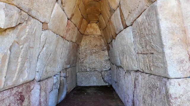 Hieroglyphic inscriptions adorn the corbelled stone vaulted interior of Chamber 2 at Hattusa's ancient Hieroglyphic Chamber site in Turkey.