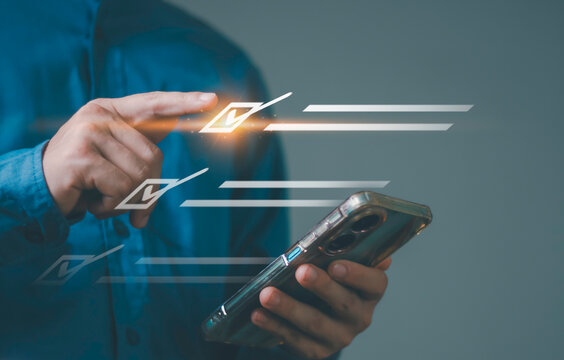 Human resource management, employee evaluation, and recruitment process driven by data and compliance systems. Business hand interacting with digital employee profile checklist interface.