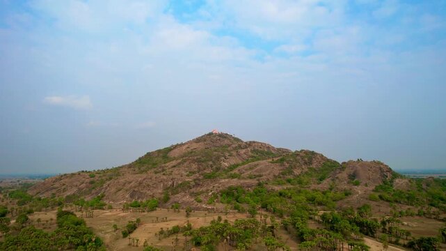 Aerial drone footage of Mandar Parvat in Banka, Bihar, showcasing the sacred hill, lush green landscape, surrounding countryside and historic pilgrimage site linked to Samudra Manthan.
