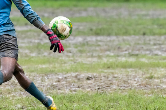 Soccer goalkeeper going to kick soccer ball