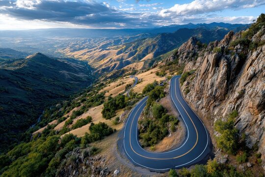 Winding Mountain Road at Sunset Aerial View