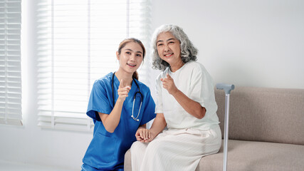 Fototapeta premium Professional nurse delivers compassionate support and dedicated assistance to happy senior woman at home fostering wellness and elder care