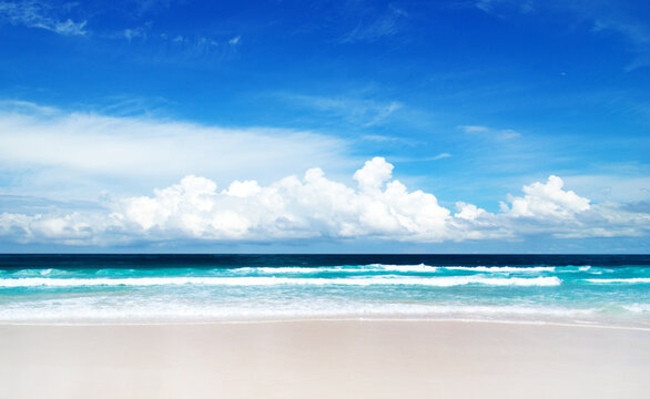 Beach and tropical sea. Blue sky
