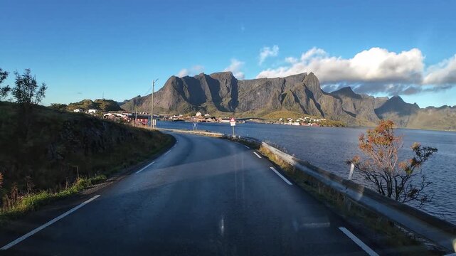 Driving a scenic road to Reine in Lofoten Islands, Norway