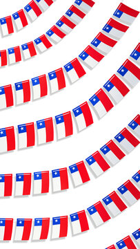 Chile flags hanging in a garland or bunting on a white background