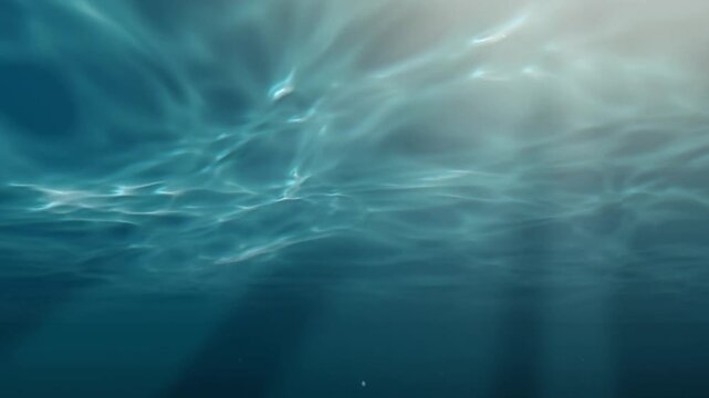 Underwater ocean surface with sun rays and caustic light patterns