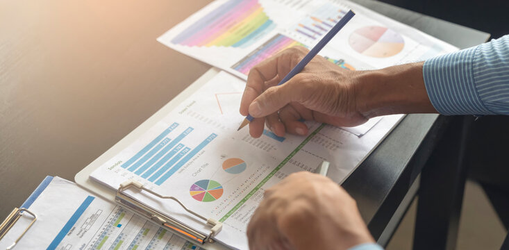 Business and Financial Planning Concept. Financial advisor planning and calculate budget, work on laptop. Professional Businesswoman discusses and analysis annual report at home office.