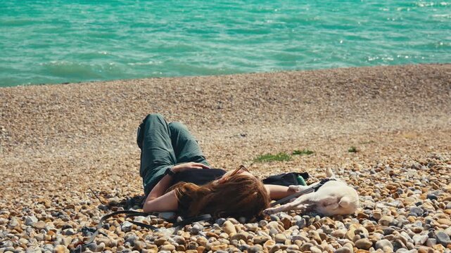 Red Haired Woman and White Dog Enjoying View of the Sea on Dover Beach