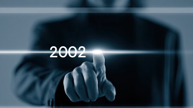 Businessman Touching Screen Displaying Year 2002.