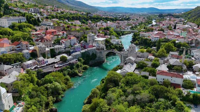 Aerial view of the historic Stari Most bridge spanning the turquoise Neretva river in the old town of Mostar, Federation of Bosnia, Bosnia and Herzegovina.