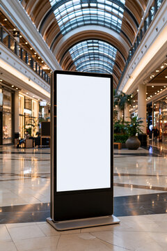 Interactive touchscreen digital kiosk with blank white display in mall wayfinding area, elegant interior architecture, balanced one-point perspective, glossy floor reflections, ret