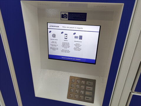 Rome, Italy - July 20, 2026: Decathlon automated parcel locker with touchscreen display and keypad for retrieving packages in a retail environment