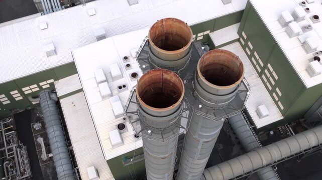 Aerial view of the exhaust stacks at the Cycle natural gas power plant, showing industrial infrastructure and emissions control systems in Dover Plains, New York, United States.