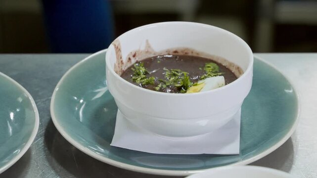 Traditional brazilian feijoada soup in restaurant kitchen