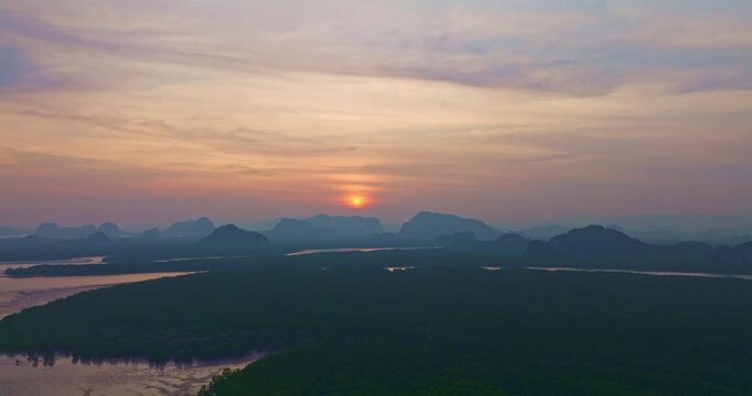 Sunset above Amazing a fishing village that lives on a small, isolated island. mangrove forests on the back. In front is a canal that leads to the sea. Landmark of seafood it is cheap and fresh.