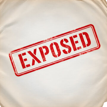 A red rubber stamp with the word exposed