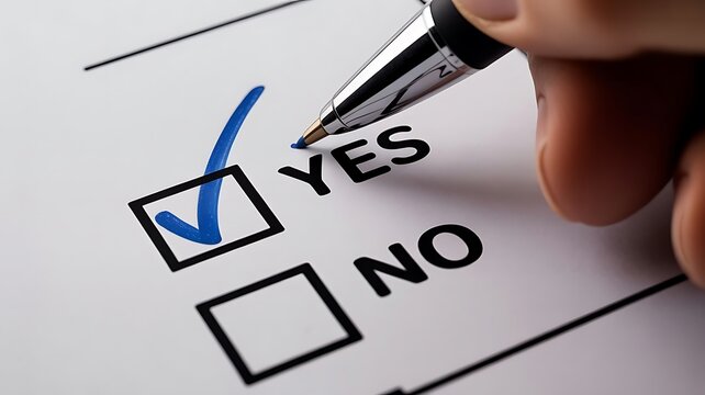A hand holding a ballpoint pen marking a blue checkmark in the yes box on a white paper survey form during a business evaluation