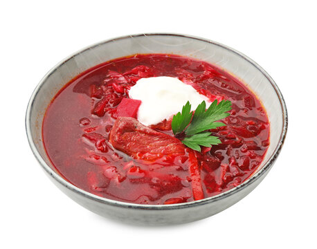 Delicious borscht with sour cream and parsley isolated on white